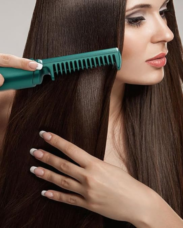 Woman with long brown hair using a green electric comb